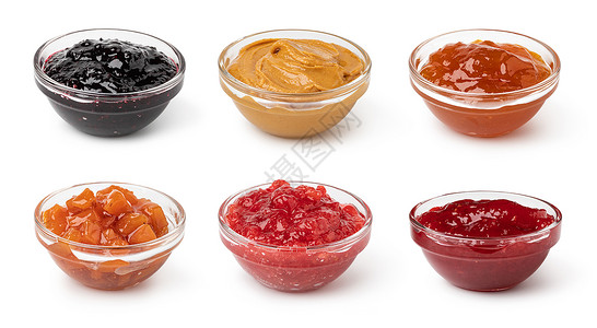 一组玻璃碗里面有在白色背景上隔离的果酱一组玻璃碗里面有果酱图片