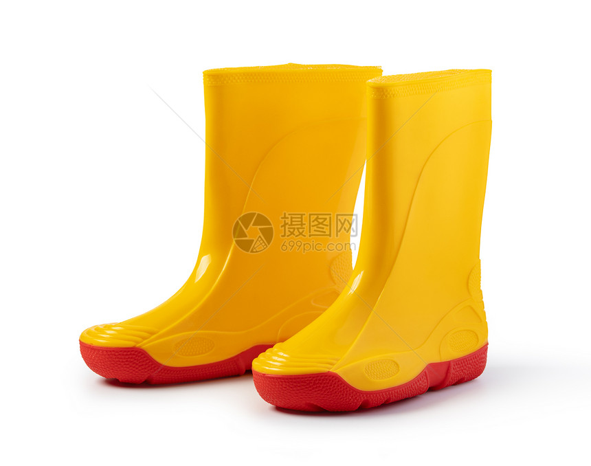 白色背景上孤立的黄色橡胶皮靴黄色橡胶皮靴图片
