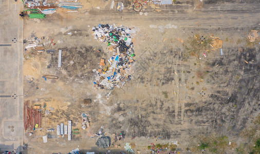 从空中查看各种垃圾堆塑料袋和工业厂垃圾堆点的环境污染垃圾倾倒场的废物处理背景图片