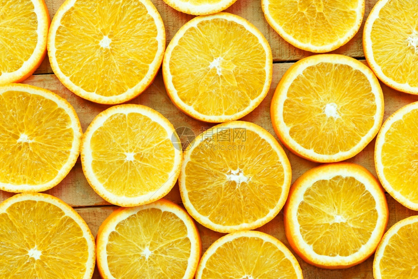 橙色切片纹理背景木的新鲜橙子水果色形态顶视图图片