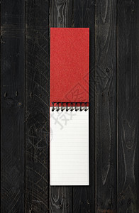黑木背景上孤立的空开螺旋笔记本模型黑木背景上孤立的空开螺旋笔记本图片