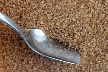 Browm糖和甘蔗汤匙的详情作为背景有用高清图片