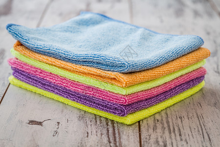 洗碗巾紫色蓝粉红橙绿黄的白木底纸巾背景