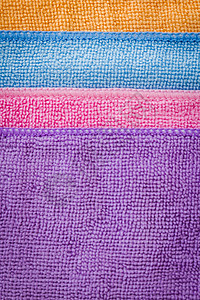 紫色蓝粉红橙餐巾纸垂直排列图片