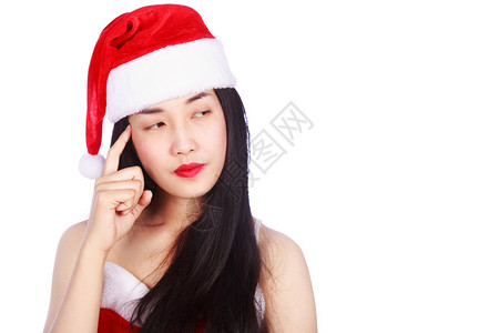 穿着圣诞老人衣服的女想着穿圣诞老人的衣服孤立在白色背景上图片