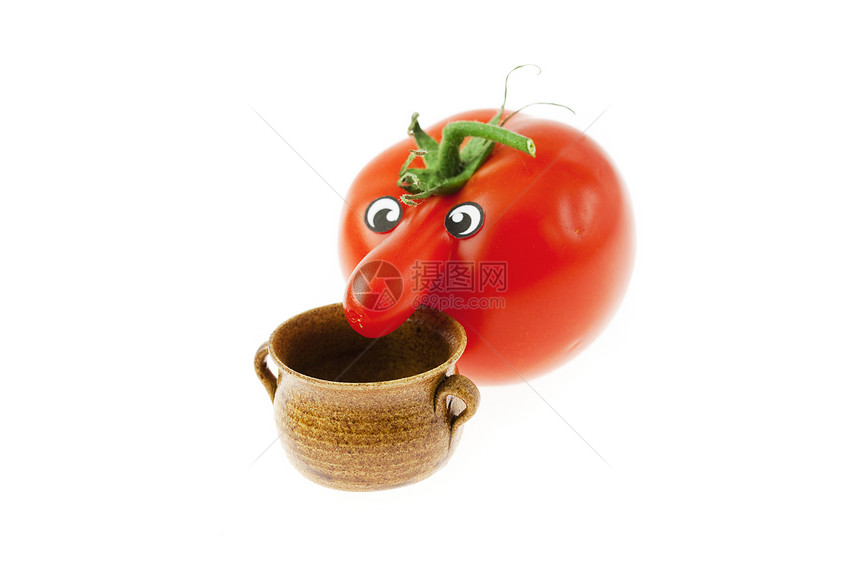 长着鼻子的西红柿和白色一小罐子图片