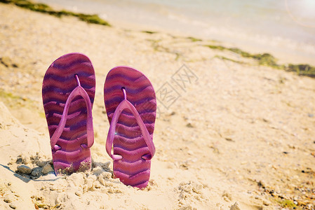 紫色海滩拖鞋在上古老的托宁图片
