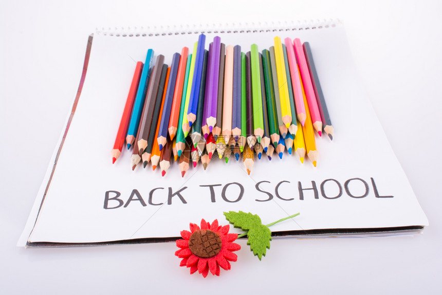 彩色铅笔假花和记本上的彩色铅笔和假花背回学校职称图片