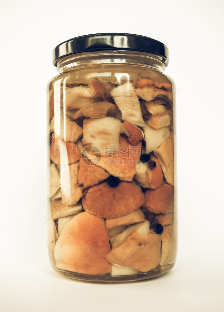 波奇尼蘑菇罐复古去饱和在一个玻璃罐子里放一个老式的去饱和的美味牛肝菌又名便士面包猪猪或洋葱蘑菇图片