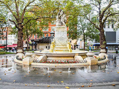 英国伦敦莱斯特广场的威廉莎士比亚1874年背景图片