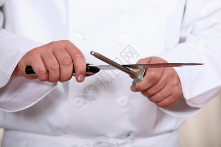 厨师磨刀背景图片