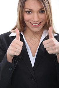快乐的女商人举起大拇指的手势图片