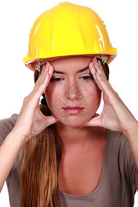 头痛的女建筑工人图片