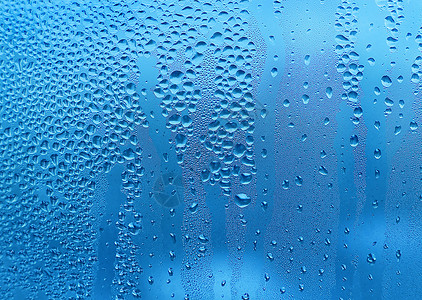 蓝色纹理玻璃上有水滴图片