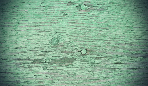 关闭旧绿漆色的经风化木用旧质纸和钉子图片