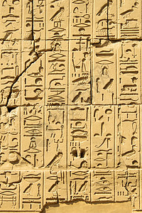 文字卡贴素材埃及卢克索卡纳寺石墙上雕刻的古代埃及象形文字背景