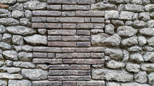 厚的古城墙有砖块和可碎石背景特写图片