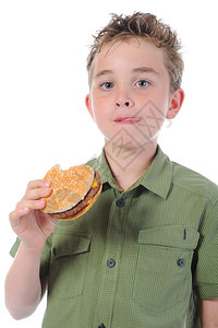 小男孩在吃汉堡包图片