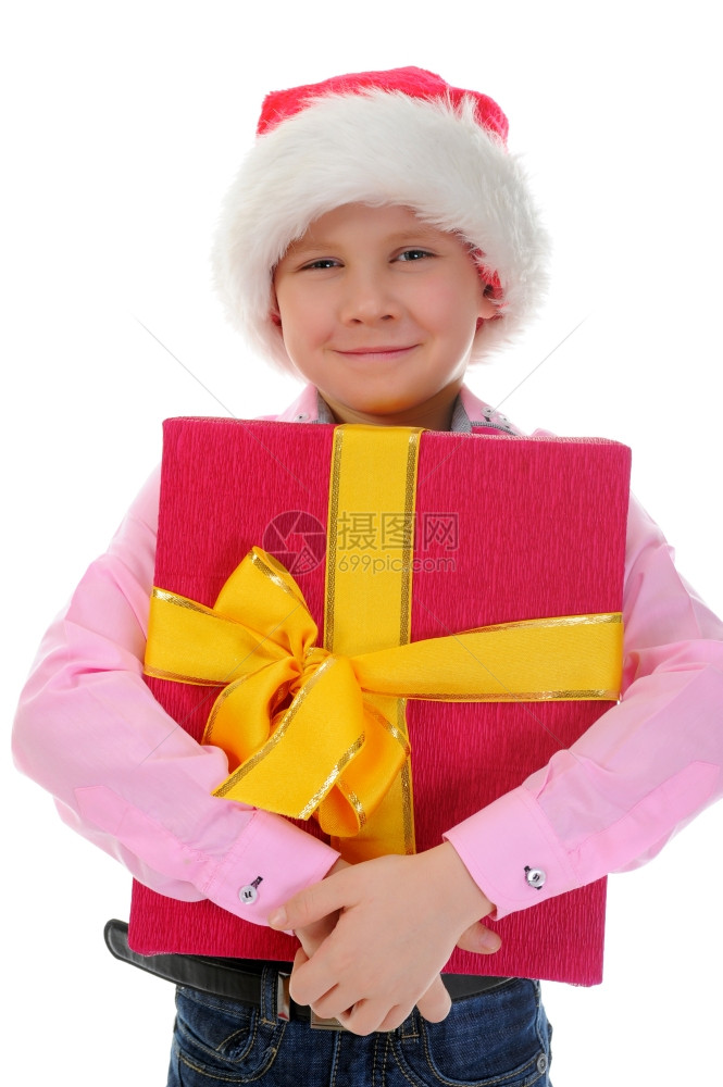 戴着圣诞帽子的快乐男孩孤立于白种背景图片