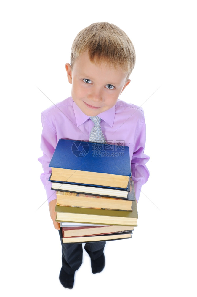 小男孩藏着一堆书孤立在白色背景上图片