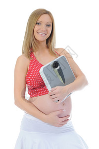 手拿天秤的年轻孕妇图片