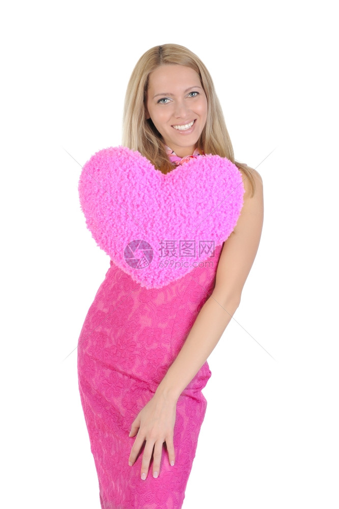 穿着粉红裙子的有趣女孩握着心在伸展的手上图片