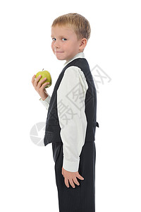 男孩持有苹果孤立于白色背景图片