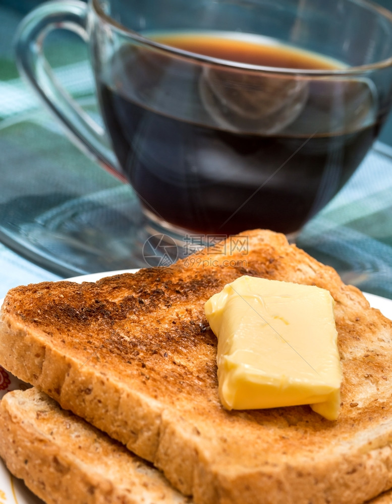 早餐黄油吐司代表晚餐时间和咖啡图片
