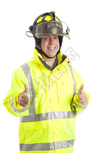 快乐笑的消防员举起两只拇指孤立在白的上面图片