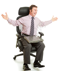 快乐的商人转身在他的舒适新人文工程椅上图片
