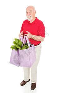 健康的老人用可重新使的布袋把食品带回家图片