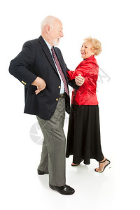 快乐的老年情侣跳着时空舞孤立在白色上图片