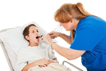 护士用舌头压抑剂和眼科检查在医院的小男孩图片