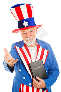 美国图标山姆叔拿着一本圣经做个欢迎手势图片