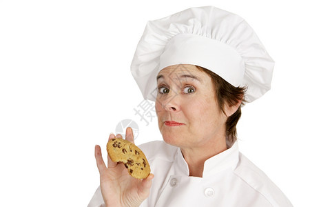 厨师享受着美味新鲜的烤巧克力饼干白色的孤立无援图片