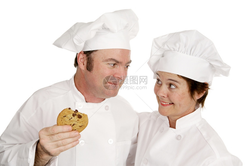 一位男厨师和女他赞美她的饼干质量图片
