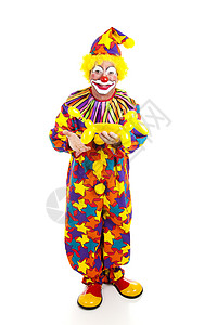 玩具小丑整个身体被孤立地看到一个拿着气球动物的生日小丑背景