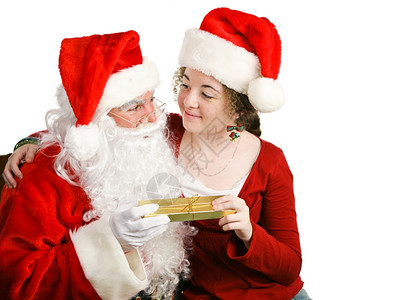 女孩坐在圣诞老人的腿上从他那里得到圣诞礼物图片