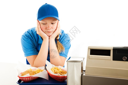 不幸的少女有份无聊工作提供快餐孤立的白种人图片