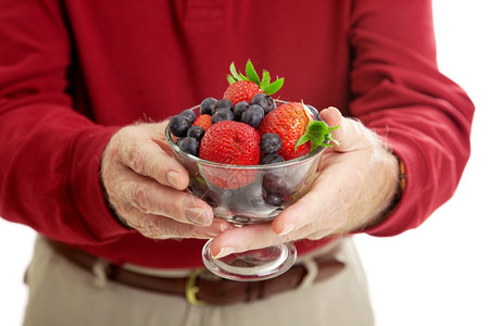 高官握着一碗健康抗氧化剂丰富的浆果图片