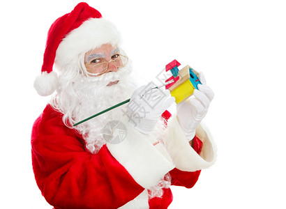 圣诞老人在节画一个小孩的玩具图片