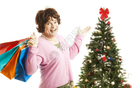 穿成女人的男去圣诞购物狂欢 拿着袋子白被孤立图片