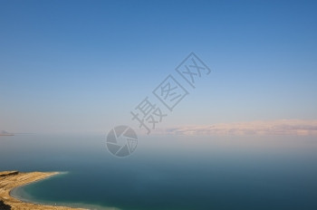 以色列死海岩石上的盐日落图片