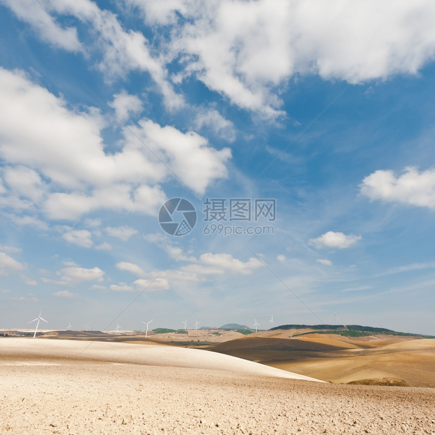 西班牙现代风力涡轮生产能源背景的播种场图片