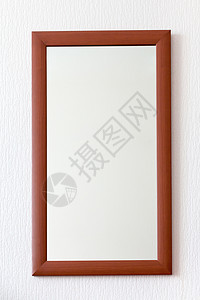 木制棕色边框中的简单壁镜子背景图片