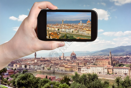 北菲奥雷旅行概念旅游者在意大利移动工具上拍摄佛罗伦萨天际的图片背景