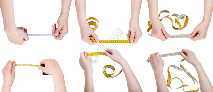 一组女手用测量磁带在白色背景上隔离背景图片