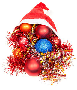 圣诞礼物白色背景的红圣塔帽脱落的Xma球和装饰图片
