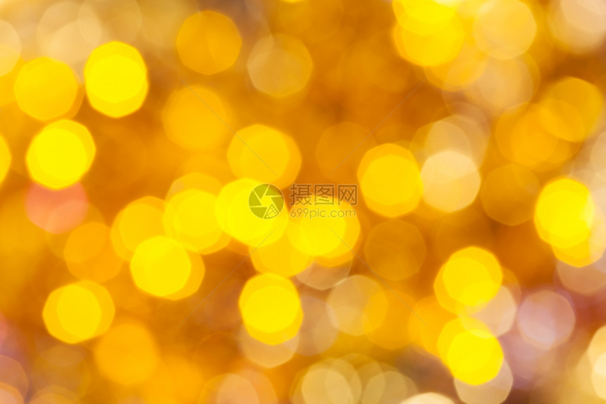 抽象的模糊背景色彩多的黄闪亮圣诞灯光图片