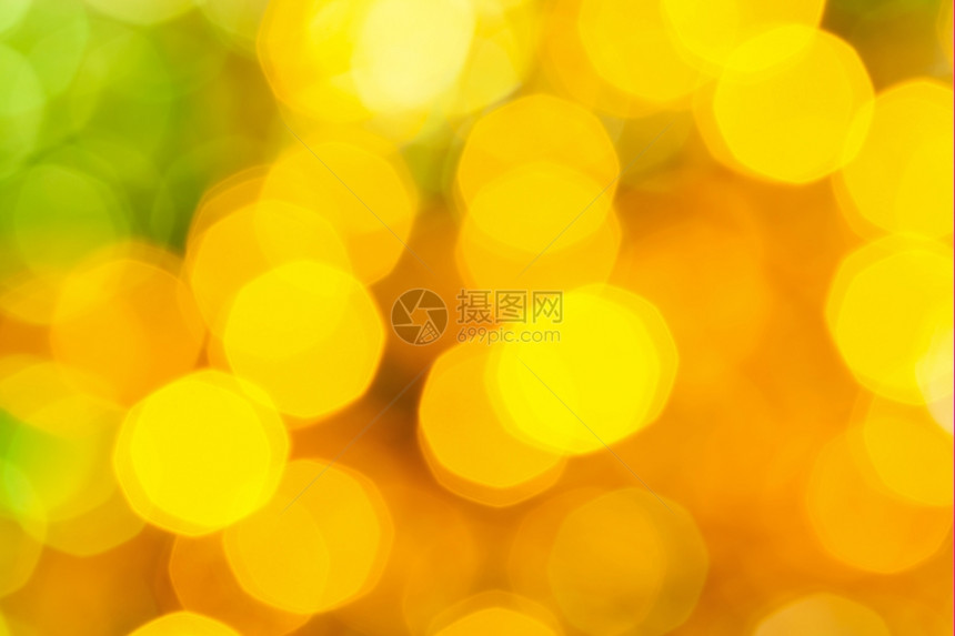 抽象的模糊背景Xmas树上电藻园大黄绿色闪亮的圣诞灯光图片